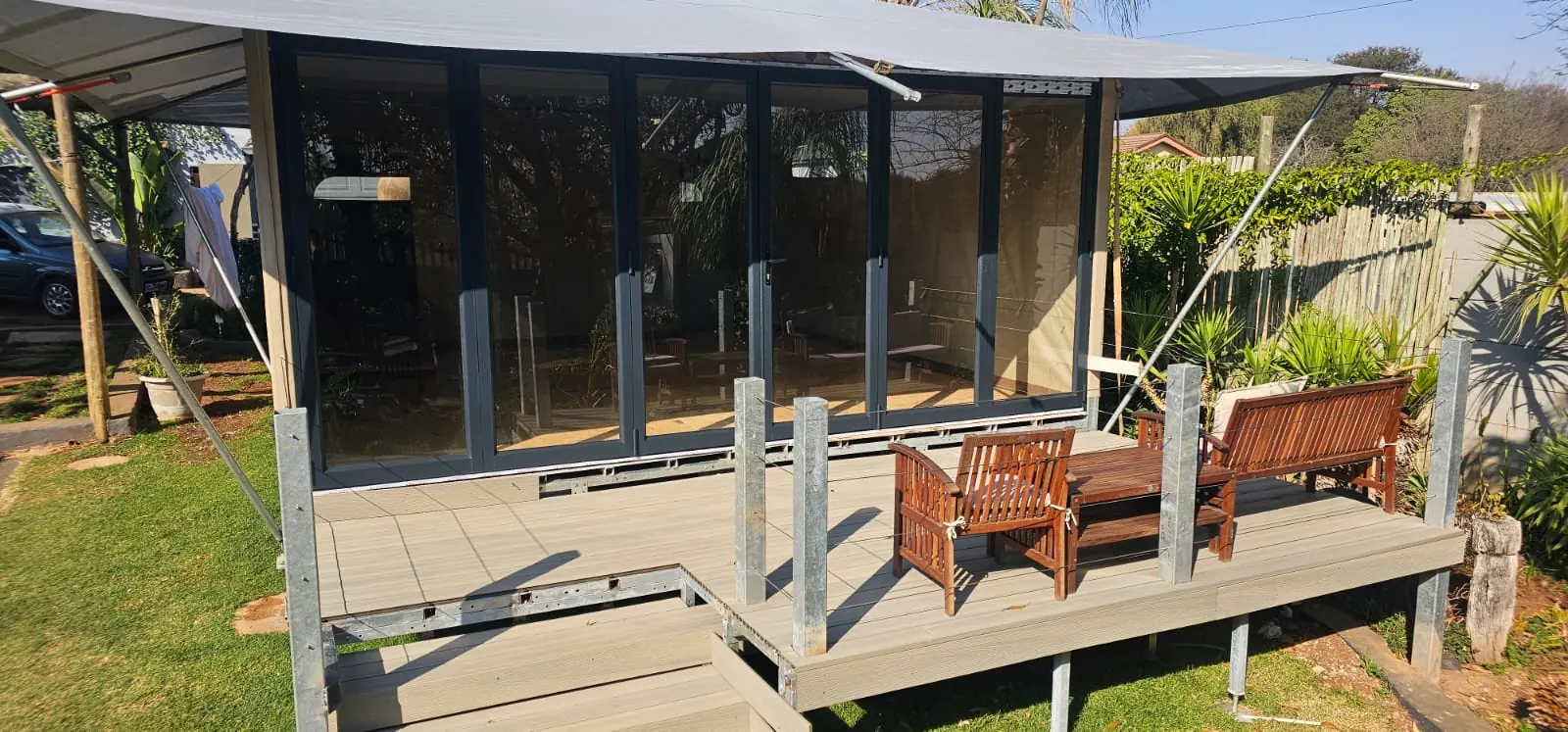 ARMIS glamping tent with Vista folding glass doors and composite deck